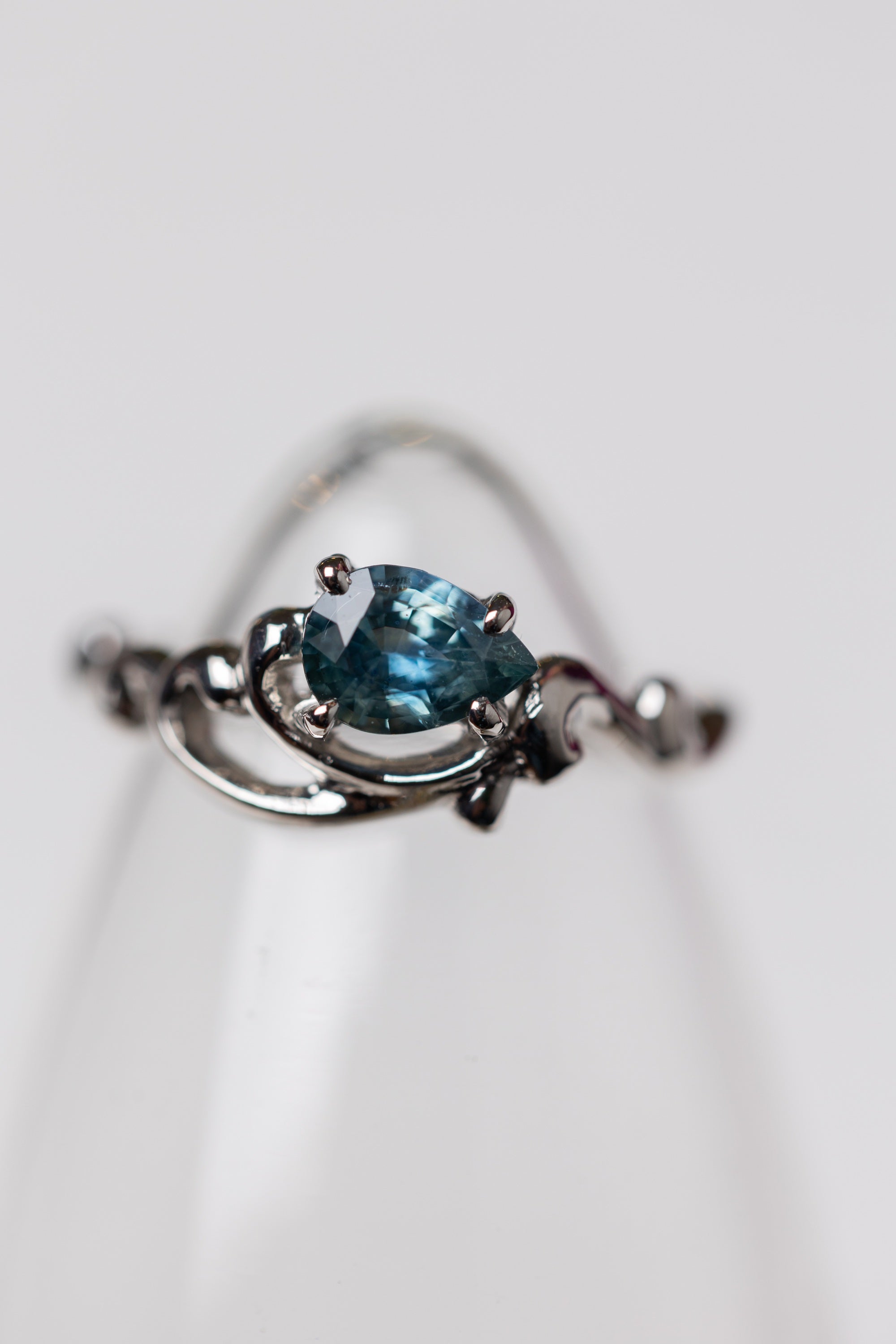 Scroll Ring with a Pear Shape Sapphire