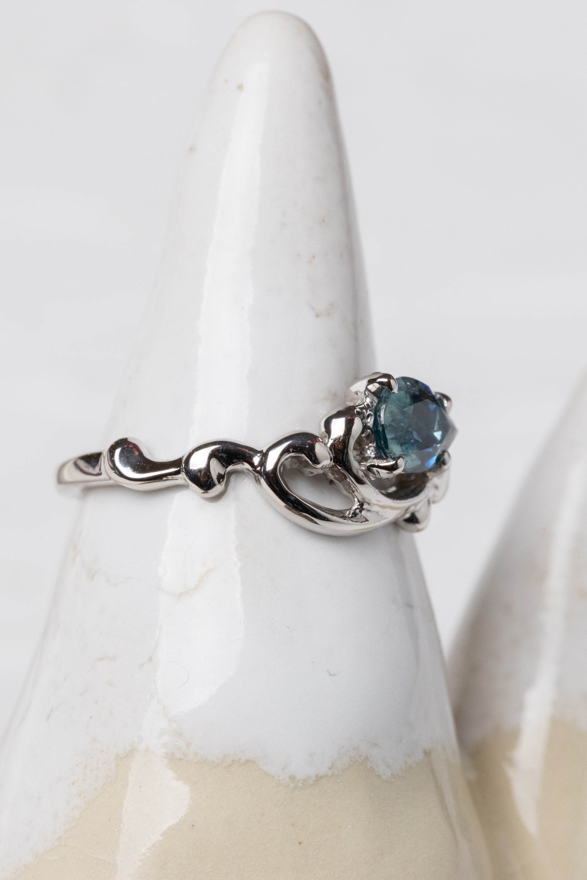 Scroll Ring with a Pear Shape Sapphire