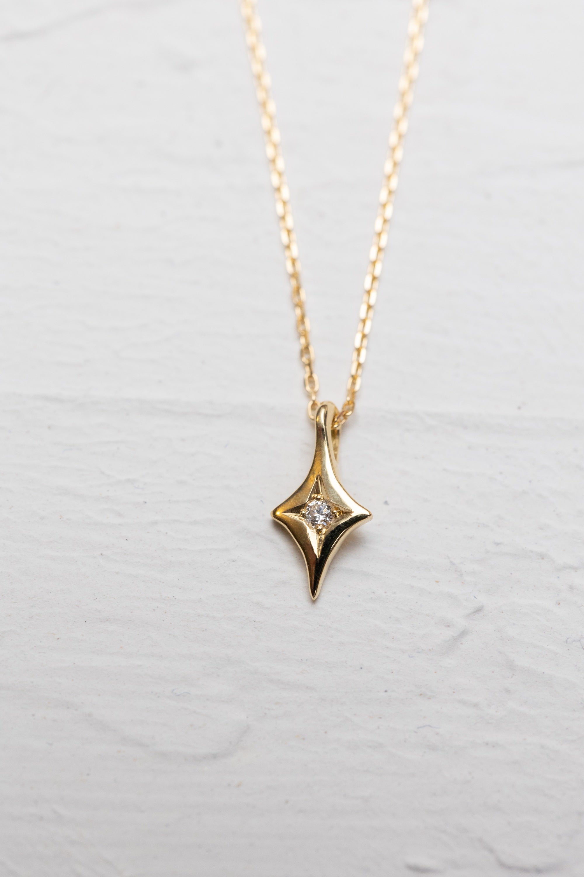Four Pointed Star Necklace in Gold