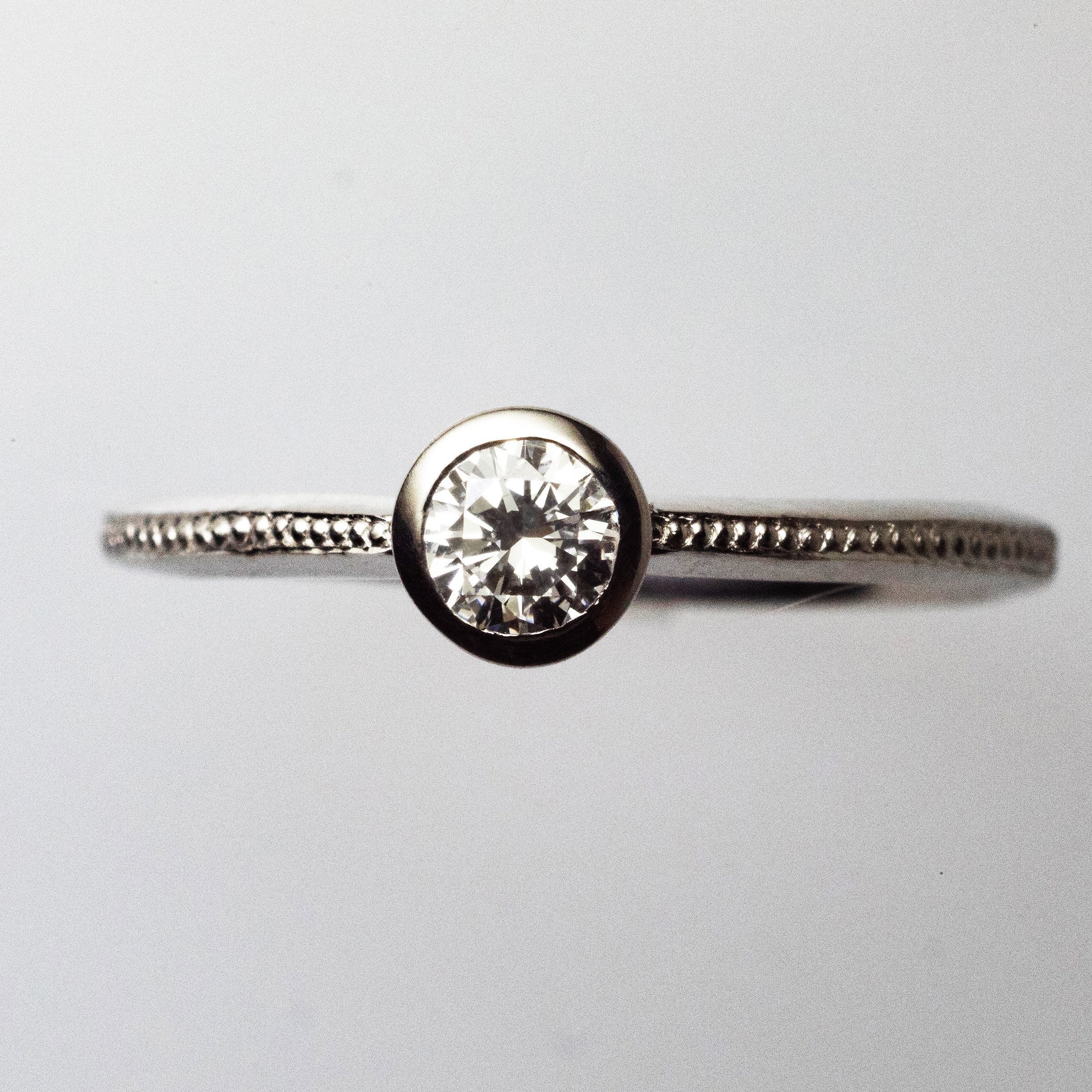 Platinum 0.2ct Solitaire Ring with Milgrain detail on Knife Edge